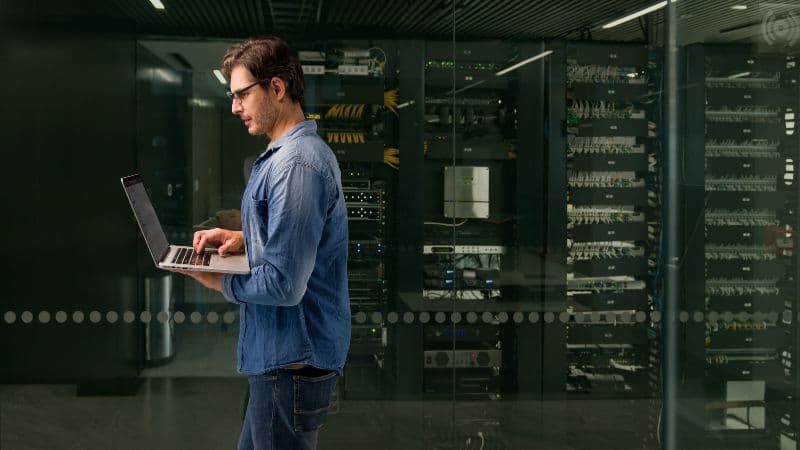 Man In A Server Room At A Data Center